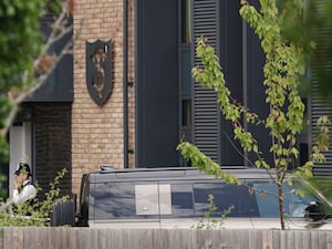 A Land Rover Defender near the school