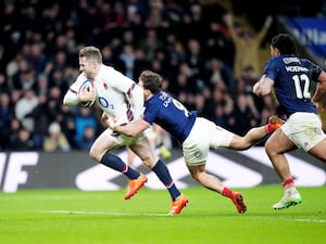 Elliot Daly, left, scores England's winning try against France