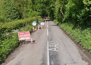 Temporary lights have been in place on the A488 in Hope for over a year after sections of the road broke away. Picture: Google