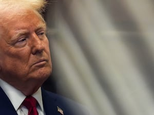 President Donald Trump looks on during a news conference in the Roosevelt Room of the White House in Washington