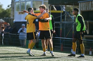 Samuel McLintock celebrates with his Rushall teammates. 