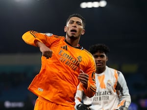 Jude Bellingham punches the air as he celebrates his late winner for Real Madrid at Manchester City