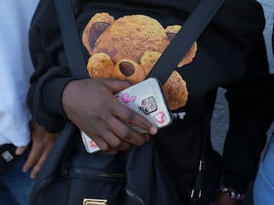 A Haitian migrant waits outside the Mexican Commission for Refugee Aid