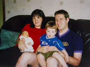 Handout photo of Alistair Wilson with his wife and sons