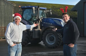 Tom Wellings (in the cheque) and Josh Barratt, founders of the Christmas Tractor Run in Bridgnorth  