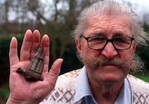 Arthur Hawkins with his souvenir of the flying bomb in 2003.