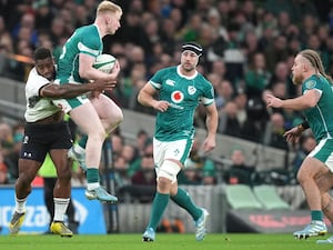 Ireland’s Jamie Osborne, with ball, is tackled by Fiji’s Josua Tuisova