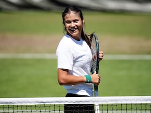 Emma Raducanu smiles during a training session at Wimbledon