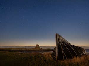 The Geminid meteor shower over Lindisfarne in Northumberland (Lee Reid/PA)