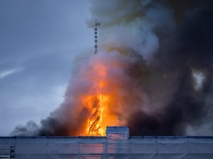 Fire and smoke rise from the Old Stock Exchange in Copenhagen in April