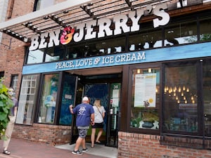 Two patrons enter the Ben & Jerry’s ice cream shop in Burlington, Vermont