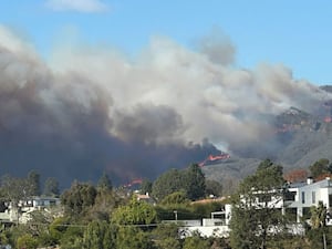 Smoke billows from a California wildfire