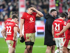 Wales’ Dafydd Jenkins reacts following their heavy defeat