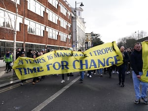 Tottenham fans protest against the club's owners ahead of the game against Manchester United, holding a banner reading '24 years, 16 managers, 1 trophy - Time for change'