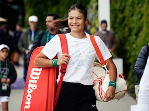 Emma Raducanu walks to the practice courts at Wimbledon