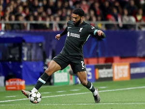 Liverpool defender Joe Gomez keeps the ball in on the touchline