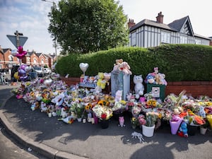 Floral tributes on the junction of Tithebarn Road and Hart Street in Southport