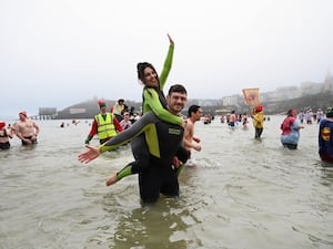 Philip Frith with Victoria Tansey at the Boxing Day swim