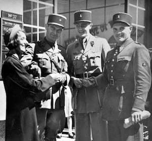 Three French officers buying a flag to help the West Midlands and Express & Star Comforts Fund in Wolverhampton