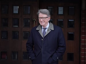 A smiling Lord Peter Mandelson outside the doors of St Mary the Virgin Church in Primrose Hill, north-west London