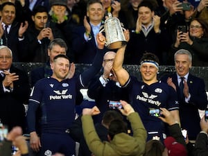 Scotland’s Finn Russell, left, and Rory Darge lift the Calcutta Cup