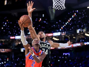 Oklahoma City Thunder guard Shai Gilgeous-Alexander shoots against Milwaukee Bucks forward Giannis Antetokounmpo