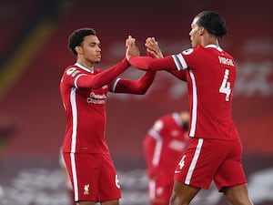 Trent Alexander-Arnold high-fives Virgil van Dijk