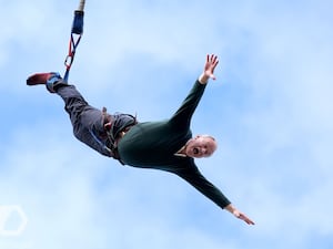 Liberal Democrat leader Sir Ed Davey taking part in a bungee jump during a visit to Eastbourne Borough Football Club in East Sussex, while on the general election campaign trail