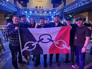 Ruth and Chris Smith-Moorhouse with their Black Country flag and members of Luke Combs UK