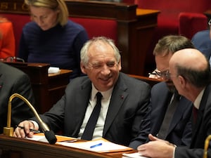 French Prime Minister Francois Bayrou sits on the ministers' bench after delivering a general policy speech