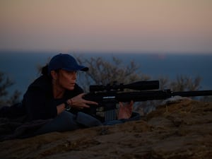 Keeley Hawes with a rifle as Julie in The Assassin