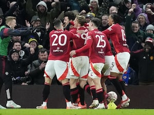 Manchester United’s Harry Maguire (centre) is mobbed by team-mates after scoring a late winner against Leicester