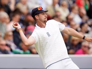 Josh Tongue throws the ball in while fielding on his England Test debut.