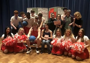 : Jacob Dixon and Nancy Minaker (centre seated) with other cast members in rehearsal for High School Musical