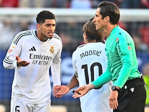 Real Madrid’s Jude Bellingham, left, speaks with team-mate Luka Modric after being sent off against Osasuna