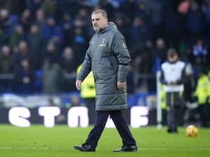 Tottenham manager Ange Postecoglou walks on the pitch