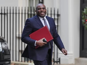 David Lammy arrives in Downing Street carrying a red ministerial folder