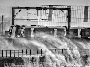 Train passing through breaking waves