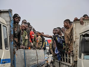 M23 rebels escort government soldiers and police who surrendered to an undisclosed location in Goma, Democratic Republic of the Congo