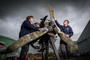 RAF Museum apprentices with engine and propeller 