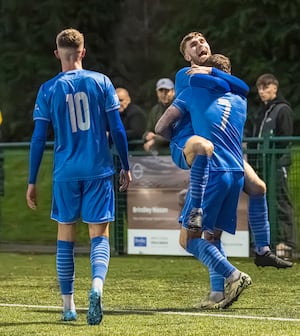 Josh Mansell helps Jack Edwards celebrate his winning goal for Lichfield (picture by Jim Wall)