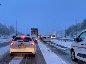 Traffic at a standstill due to snow on the M62 motorway near Kirklees, West Yorkshire