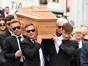 Ronan Keating helps carry the coffin of his brother Ciaran (PA)