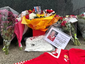 Tributes have been laid to Denis Law outside Old Trafford