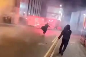 A hooded thug was captured on camera dangerously shooting at least 50 fireworks towards people near Birmingham City Centre