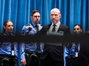 Anders Breivik with three prison guards