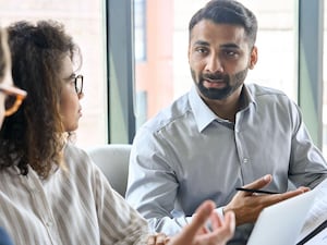 People having a discussion at a boardroom meeting