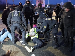 Police clear a blockade at a demonstration