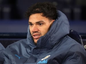 Ederson watches on from the dugout