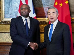 David Lammy shaking hands with Wang Yi